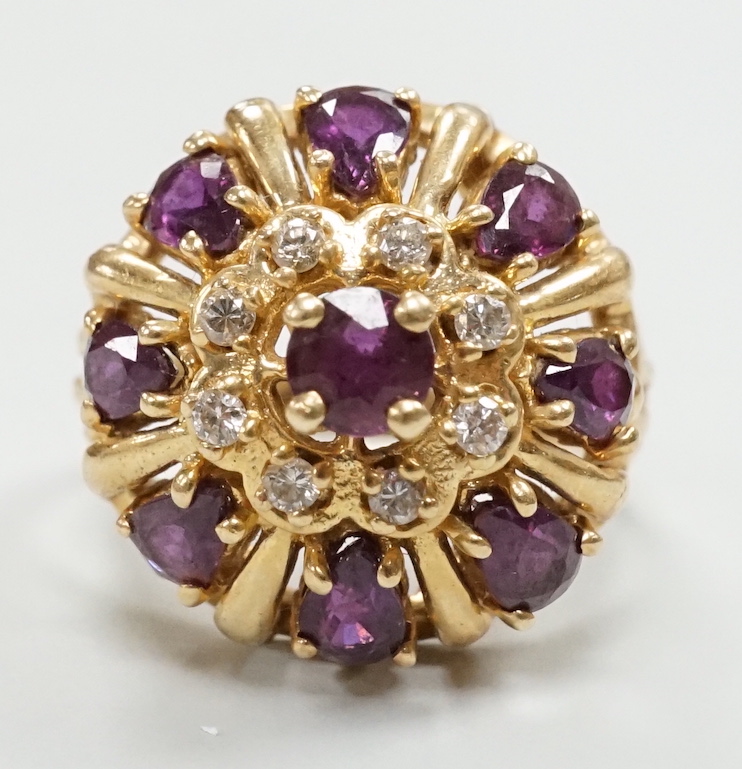 A modern 14ct gold, amethyst? and diamond chip cluster set domed dress ring, size M, gross weight 7.2 grams.